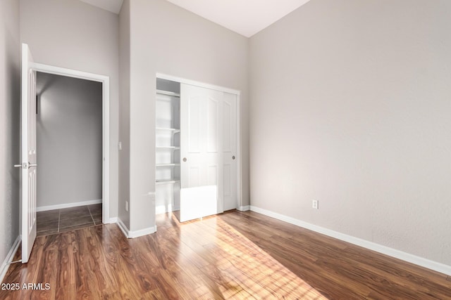 4215 W Hackamore Dr, Phoenix, AZ 85083 - unfurnished bedroom with wood finished floors, a closet, and baseboards