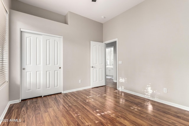 4215 W Hackamore Dr, Phoenix, AZ 85083 - unfurnished bedroom with wood finished floors, baseboards, and a closet