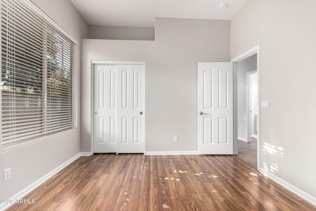 4215 W Hackamore Dr, Phoenix, AZ 85083 - unfurnished bedroom featuring wood finished floors, a closet, and baseboards