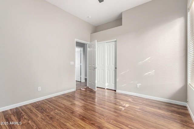4215 W Hackamore Dr, Phoenix, AZ 85083 - unfurnished bedroom featuring wood finished floors, baseboards, a closet, and a ceiling fan