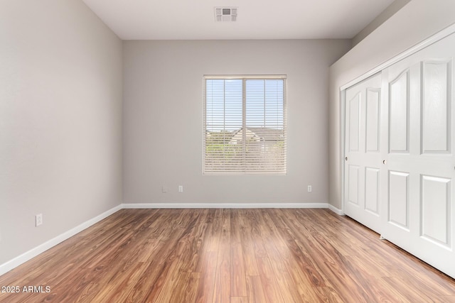 4215 W Hackamore Dr, Phoenix, AZ 85083 - unfurnished bedroom featuring baseboards, light wood-style flooring, and a closet