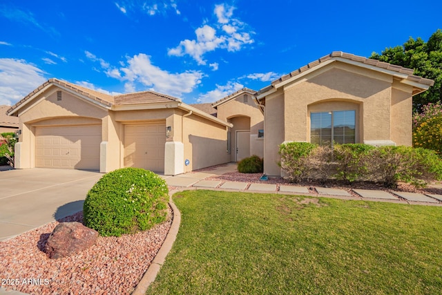 4215 W Hackamore Dr, Phoenix, AZ 85083 - mediterranean / spanish home with stucco siding, a garage, a front yard, and concrete driveway