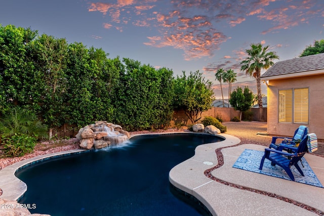 4215 W Hackamore Dr, Phoenix, AZ 85083 - pool at dusk featuring a fenced backyard and a patio area
