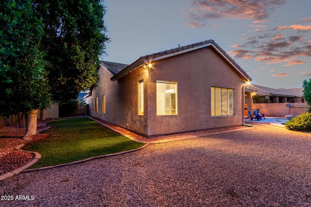 4215 W Hackamore Dr, Phoenix, AZ 85083 - view of side of property with stucco siding and a patio