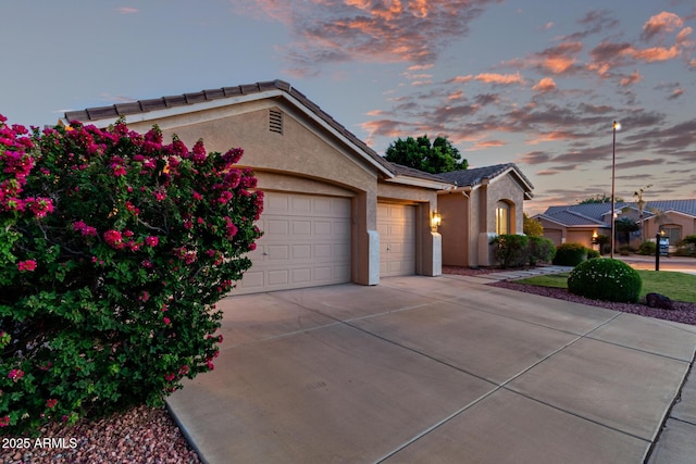 4215 W Hackamore Dr, Phoenix, AZ 85083 - view of front of house with a garage, stucco siding, driveway, and a tiled roof