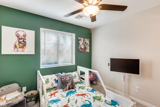 carpeted bedroom with baseboards, visible vents, and ceiling fan