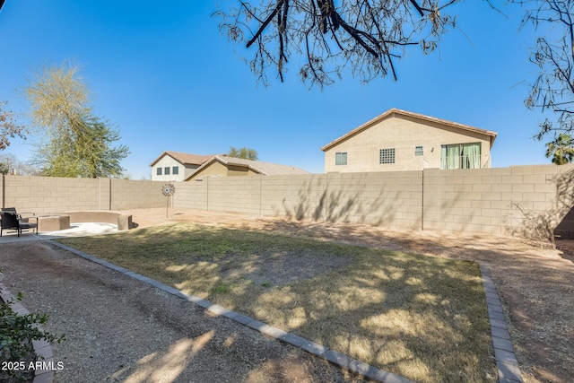 view of yard with a patio and a fenced backyard