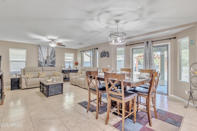 dining space featuring light tile patterned flooring, baseboards, visible vents, and a ceiling fan