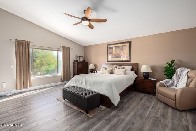 bedroom with ceiling fan, lofted ceiling, and hardwood / wood-style flooring