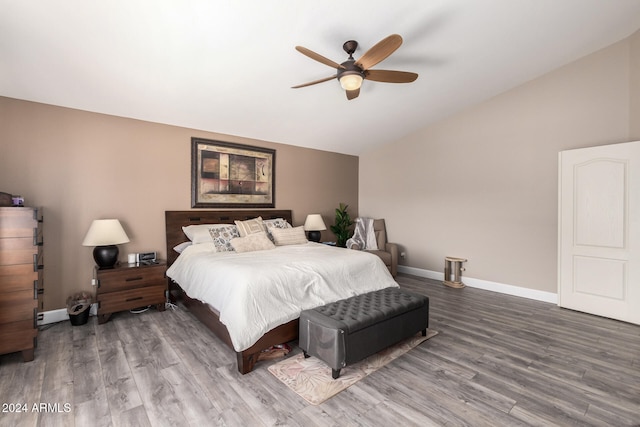 bedroom featuring wood-type flooring, ceiling fan, and lofted ceiling