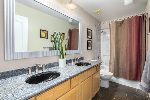 full bathroom with shower / bath combination with curtain, toilet, and vanity