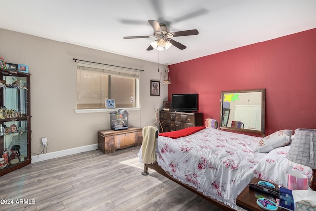 bedroom featuring hardwood / wood-style flooring and ceiling fan