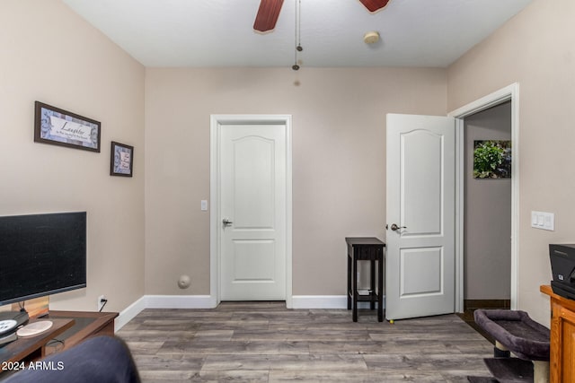 office space featuring dark hardwood / wood-style flooring and ceiling fan