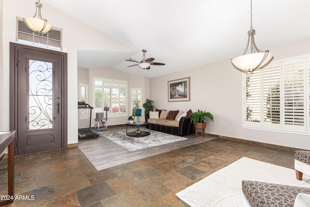 foyer with ceiling fan and lofted ceiling