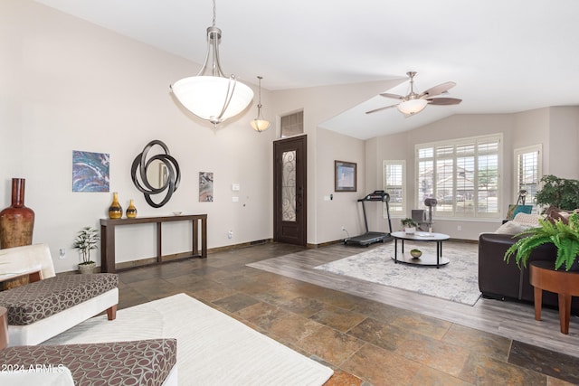 living room featuring vaulted ceiling and ceiling fan