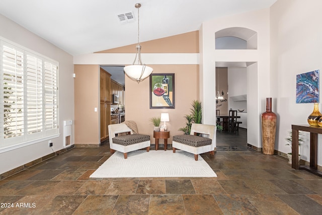 living area with vaulted ceiling