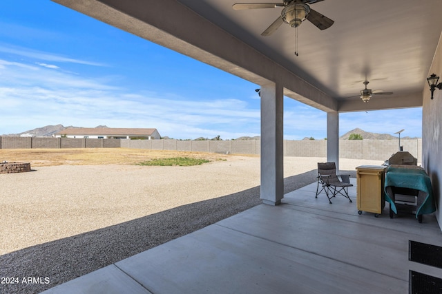 view of patio with a ceiling fan and a fenced backyard