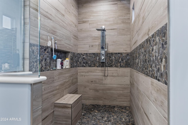 full bathroom with a tile shower