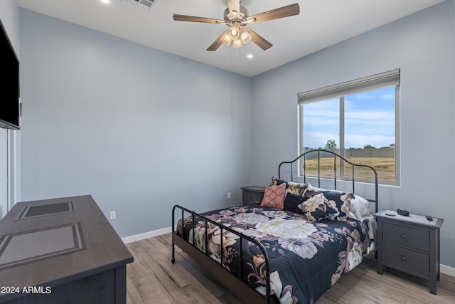 bedroom with visible vents, light wood-style flooring, recessed lighting, baseboards, and ceiling fan