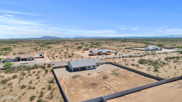 bird's eye view with a mountain view, a rural view, and a desert view