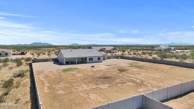 birds eye view of property featuring a mountain view