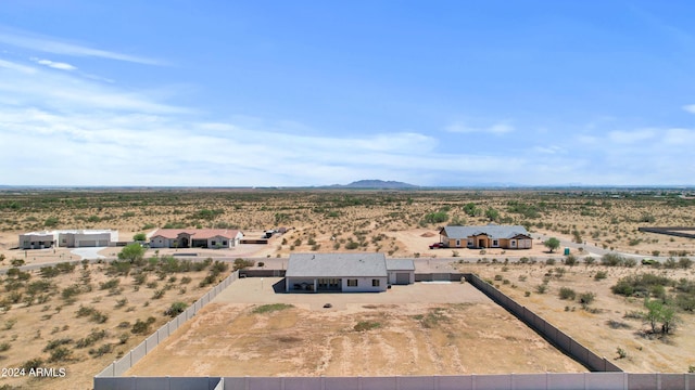 drone / aerial view with a mountain view, a rural view, and a desert view