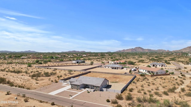 drone / aerial view with view of desert and a mountain view