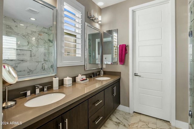 bathroom with vanity and a shower with shower door