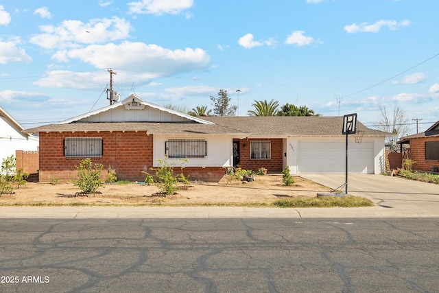 ranch-style home featuring driveway, an attached garage, and brick siding