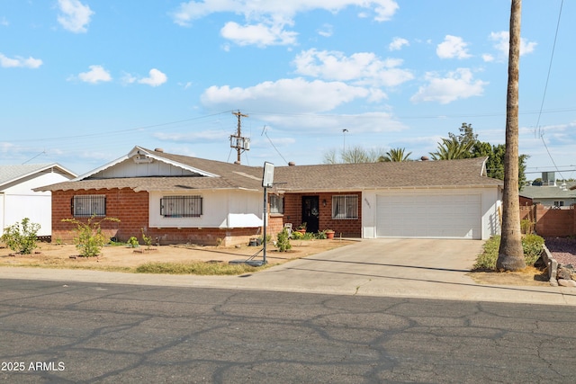 ranch-style house featuring driveway, brick siding, roof with shingles, and an attached garage