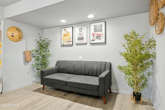 sitting room with recessed lighting, wood finished floors, and baseboards