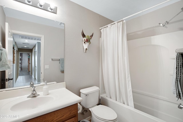 full bathroom with vanity, toilet, and shower / bath combo