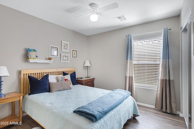 bedroom featuring wood-type flooring and ceiling fan