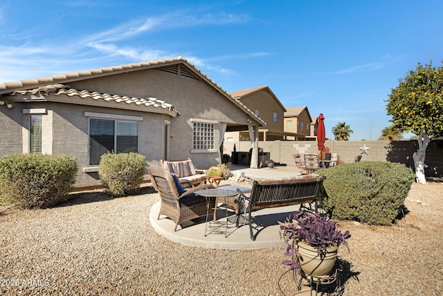 back of house featuring a patio area