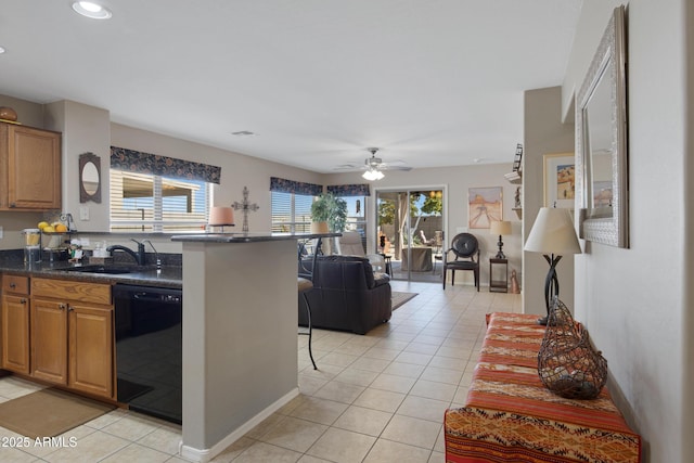 kitchen with dishwasher, a wealth of natural light, and light tile patterned floors