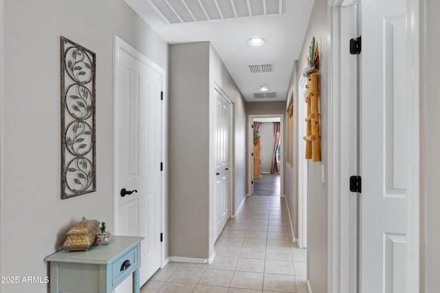 hallway featuring light tile patterned flooring