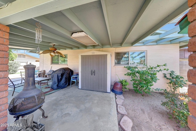 view of patio featuring ceiling fan, grilling area, and fence