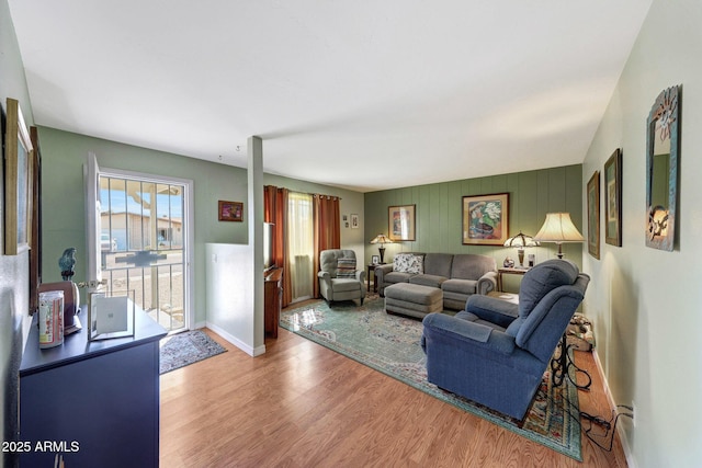 living room with wood finished floors and baseboards