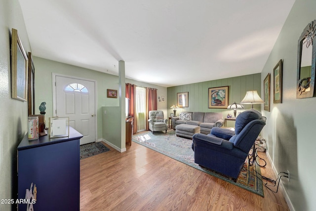 living room featuring wood finished floors and baseboards