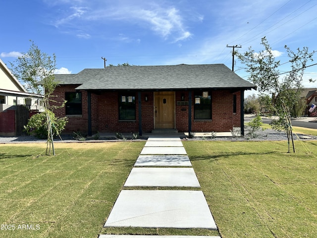 1551 W Vernon Ave, Phoenix, AZ 85007 - view of front facade with brick siding, a shingled roof, and a front yard