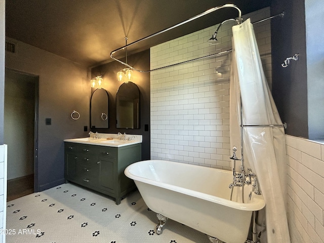 1551 W Vernon Ave, Phoenix, AZ 85007 - bathroom with a freestanding bath, double vanity, tile walls, and a shower with curtain