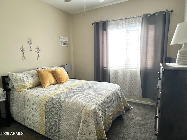 carpeted bedroom featuring multiple windows