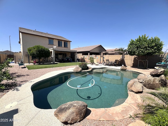 view of pool featuring a fenced backyard, a fenced in pool, and a patio