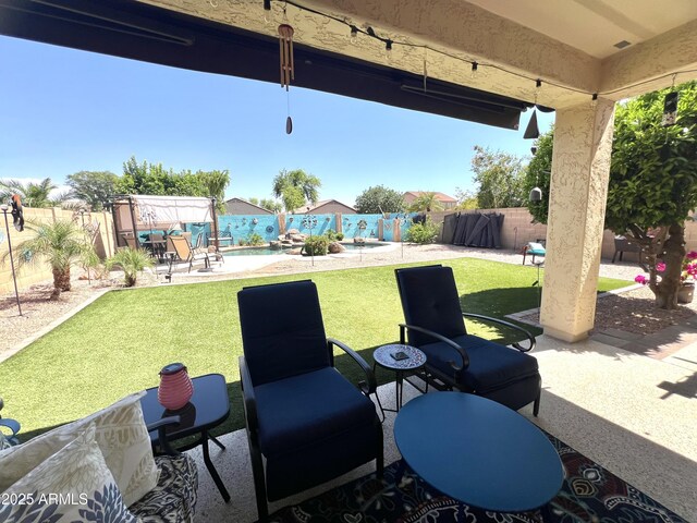 view of patio with a fenced in pool and a fenced backyard