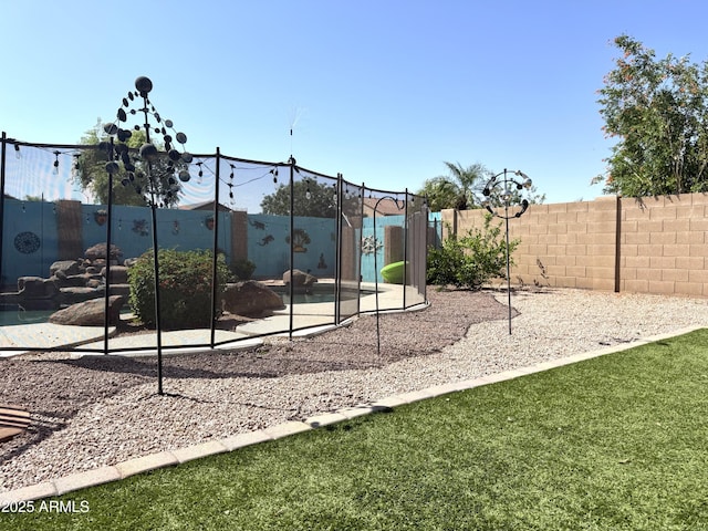 view of play area featuring fence