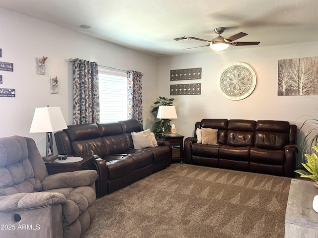 living room with carpet floors, ceiling fan, and visible vents