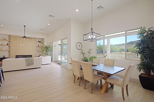 dining space featuring light hardwood / wood-style floors and ceiling fan