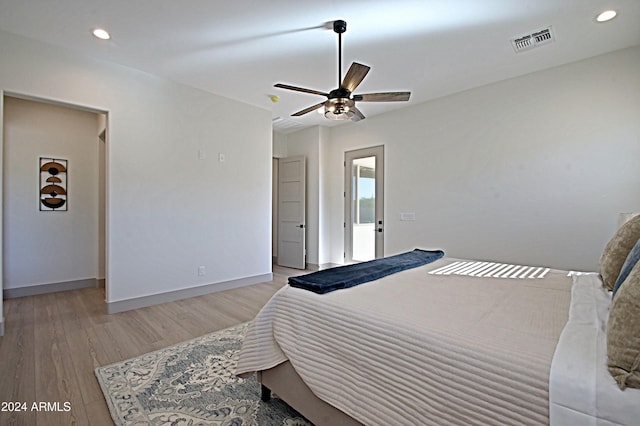 bedroom with ceiling fan and light hardwood / wood-style flooring