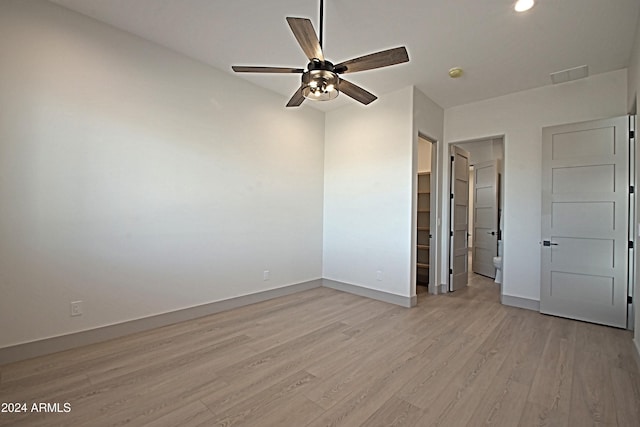 interior space with light wood-type flooring and ceiling fan