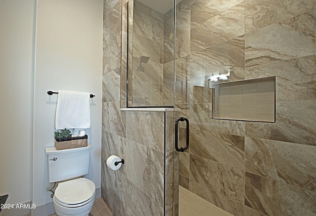 bathroom with toilet and an enclosed shower